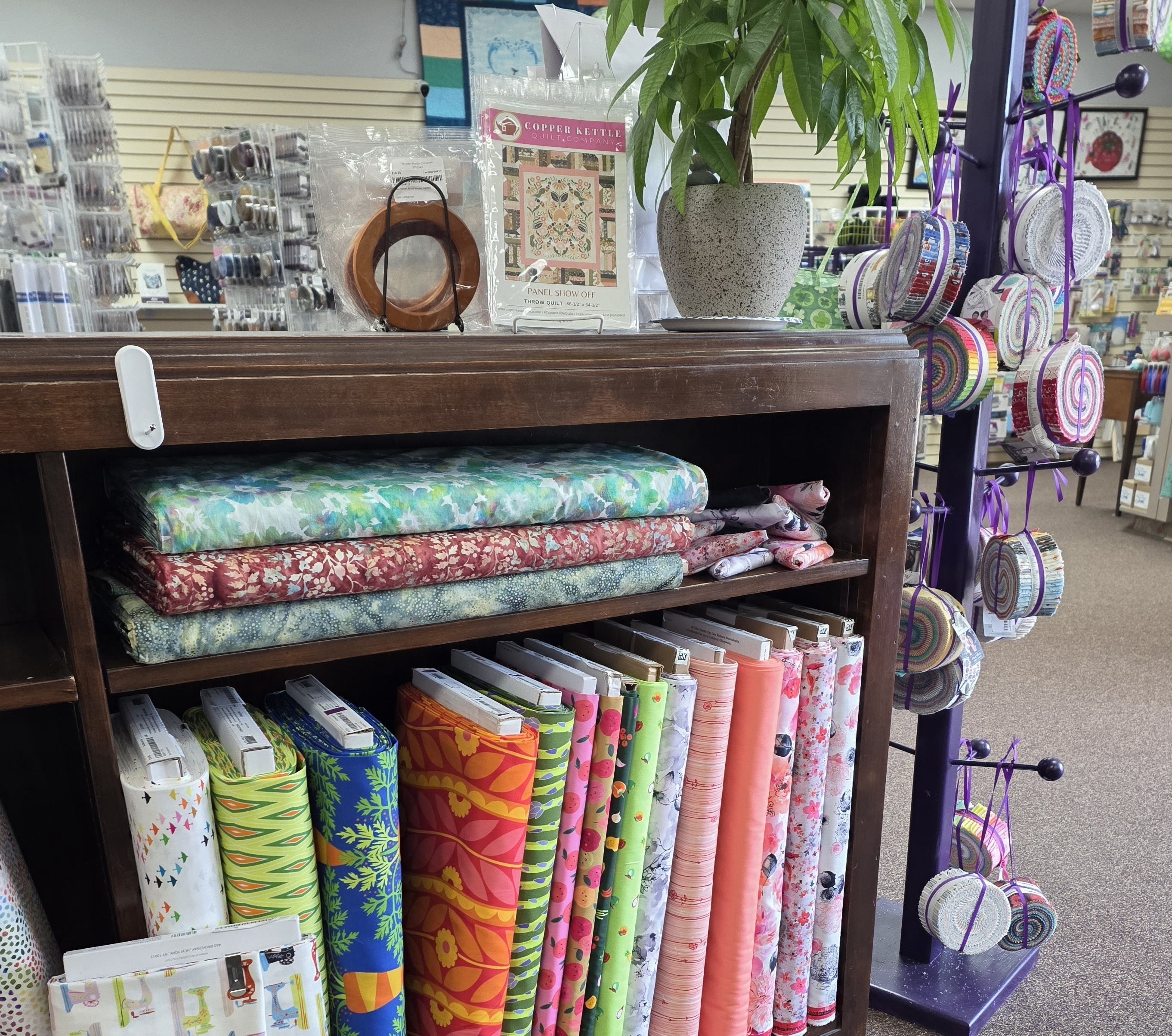 D'Sewist Quilt Shop, fabric on shelf and other notions
