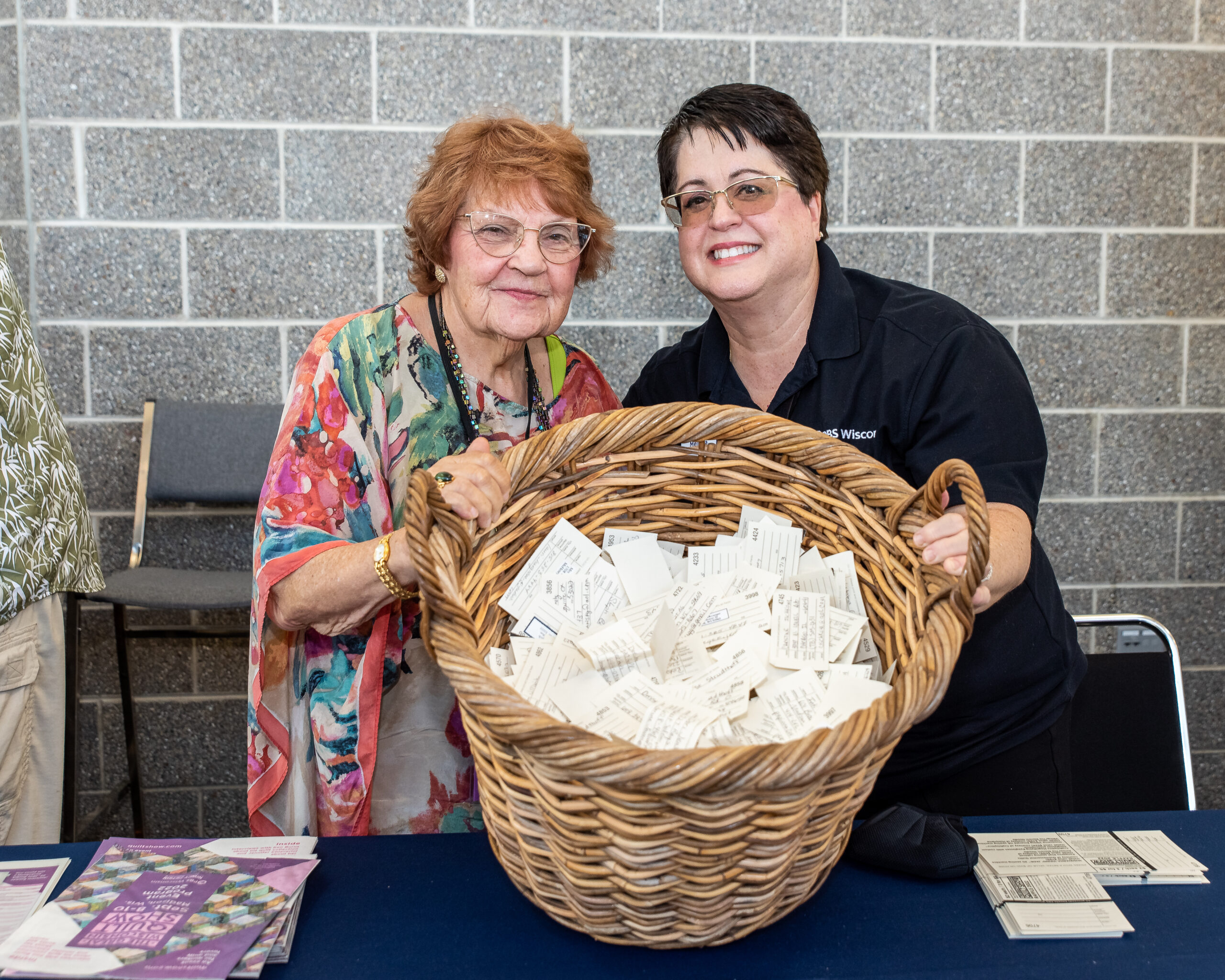 Two women holding basket