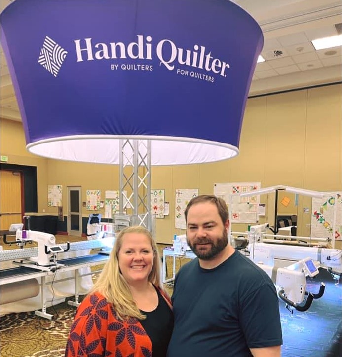 Handi Quilter longarm show display and machines