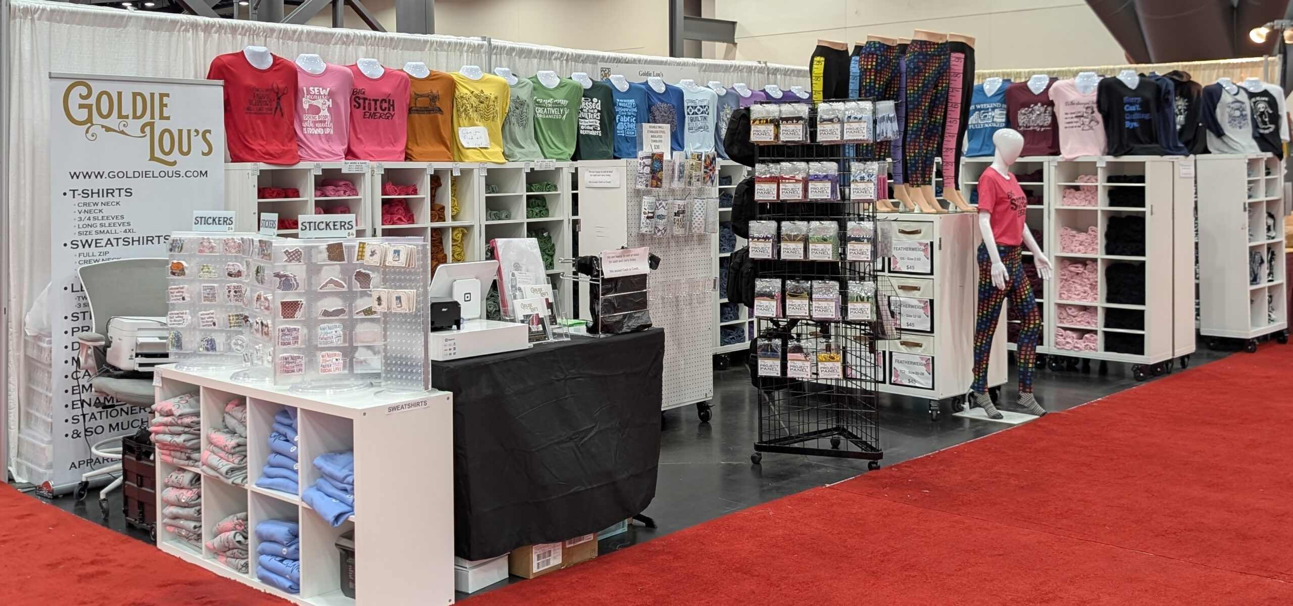 Display of quilt related gifts including shirts and cards